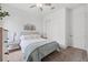 Comfortable bedroom featuring neutral tones, a ceiling fan, and a closet with sliding doors at 5005 Southern Valley Loop, Brooksville, FL 34601