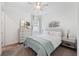 Cozy bedroom with soft lighting, a decorative headboard, and ample natural light from the window at 5005 Southern Valley Loop, Brooksville, FL 34601