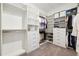 Well-organized walk-in closet with custom shelving, drawers, and ample storage space for clothing and accessories at 5005 Southern Valley Loop, Brooksville, FL 34601
