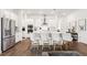 Modern kitchen with a large island, stainless steel appliances, and stylish seating at 5005 Southern Valley Loop, Brooksville, FL 34601