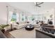 Spacious living room with neutral tones, modern furnishings, and large windows for natural light at 5005 Southern Valley Loop, Brooksville, FL 34601