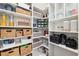Walk-in pantry offers ample storage with multiple shelves and space for organization at 5005 Southern Valley Loop, Brooksville, FL 34601