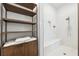 Elegant shower features white subway tile, a built-in bench, and a sleek, modern shower head at 5005 Southern Valley Loop, Brooksville, FL 34601