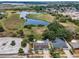 Beautiful aerial view showcasing the home's serene waterfront and lush surroundings, featuring an inviting pool at 5132 Flora Ave, Holiday, FL 34690