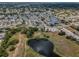 Scenic aerial shot of lakes, winding trails and green spaces in the community at 5132 Flora Ave, Holiday, FL 34690