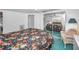 Bright bedroom with a mirrored closet and comfortable furnishings at 5132 Flora Ave, Holiday, FL 34690