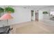 Bright bedroom with tile floors, ceiling fan, and closet at 5132 Flora Ave, Holiday, FL 34690