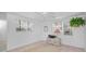 Bright bedroom with ceiling fan, neutral carpet, and mirrored wall at 5132 Flora Ave, Holiday, FL 34690