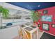 Charming dining area with a view of the screened-in pool area, perfect for casual meals at 5132 Flora Ave, Holiday, FL 34690