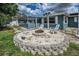 Inviting fire pit area with Adirondack chairs for cozy outdoor gatherings at 5132 Flora Ave, Holiday, FL 34690