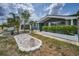 Charming home featuring manicured landscaping, lush greenery, and a professionally installed ADT security system at 5132 Flora Ave, Holiday, FL 34690