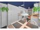 Bright kitchen featuring white cabinetry, modern appliances, and a breakfast nook with backyard view at 5132 Flora Ave, Holiday, FL 34690