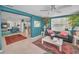 Bright and open living room with ample light, stylish furnishings and view into Gathering room at 5132 Flora Ave, Holiday, FL 34690