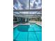 Enclosed pool with lounge seating that provides the ultimate relaxation space at 5132 Flora Ave, Holiday, FL 34690