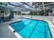 Enclosed pool area providing a private retreat with clear blue water at 5132 Flora Ave, Holiday, FL 34690