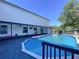 Well-maintained backyard with a sparkling pool, deck, and ample space for outdoor activities at 6158 Sumter Dr, Brooksville, FL 34602