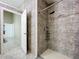 Shower in bathroom featuring tiled walls, new fixtures, and natural light at 6158 Sumter Dr, Brooksville, FL 34602