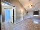 Spacious bedroom with tile flooring, built-in shelves, neutral colors, and bright lighting at 6158 Sumter Dr, Brooksville, FL 34602
