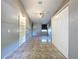 Comfortable bedroom with tile flooring, bright lighting, built-in shelves, and ample closet space at 6158 Sumter Dr, Brooksville, FL 34602