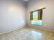 A room with tile floors, a window overlooking the pool, and neutral-colored walls at 6158 Sumter Dr, Brooksville, FL 34602