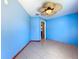 Bedroom featuring light blue walls, tile flooring, and a unique ceiling fan at 6158 Sumter Dr, Brooksville, FL 34602