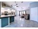 Open-concept living room and kitchen area featuring tile flooring and plenty of natural light at 6158 Sumter Dr, Brooksville, FL 34602