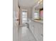 Bathroom with a marble countertop, classic fixtures, and updated mirror at 6231 Westport Dr, Port Richey, FL 34668