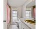 Bathroom with a marble countertop, classic fixtures, and plenty of light at 6231 Westport Dr, Port Richey, FL 34668