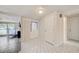 Open foyer showcasing tile flooring and access to various rooms, offering practicality and style at 6231 Westport Dr, Port Richey, FL 34668
