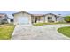 Charming single-story home with a one-car garage and a long driveway in a sunny location at 6231 Westport Dr, Port Richey, FL 34668