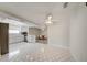 Spacious kitchen featuring tile floors, white cabinets, and stainless steel appliances at 6231 Westport Dr, Port Richey, FL 34668