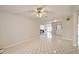 Spacious living room boasts neutral paint, tiled floors and a ceiling fan at 6231 Westport Dr, Port Richey, FL 34668
