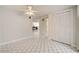 Open concept living room featuring tiled floors and a ceiling fan at 6231 Westport Dr, Port Richey, FL 34668