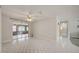 Open living room featuring tiled floors and glass sliding doors to the backyard at 6231 Westport Dr, Port Richey, FL 34668