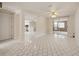 Open living room featuring beautiful floors and glass sliding doors to the backyard at 6231 Westport Dr, Port Richey, FL 34668