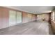 The spacious sunroom offers multiple sliding glass doors and tile flooring at 6231 Westport Dr, Port Richey, FL 34668
