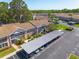 Aerial view of building showing lush greenery, parking, and well-maintained grounds at 6508 Tina Dr # 14, New Port Richey, FL 34653