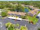 Aerial view of condo with pond view and convenient access to parking at 6508 Tina Dr # 14, New Port Richey, FL 34653