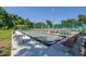 Inviting bocce ball court surrounded by benches and lush greenery offers a social recreational space at 6508 Tina Dr # 14, New Port Richey, FL 34653