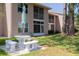 Back exterior view of the property with a patio set on a grassy lawn with second story screened in balconies at 6508 Tina Dr # 14, New Port Richey, FL 34653