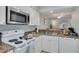 A kitchen view with an open layout and plenty of counter space at 6508 Tina Dr # 14, New Port Richey, FL 34653