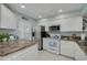 Bright kitchen with stainless steel appliances and white cabinetry at 6508 Tina Dr # 14, New Port Richey, FL 34653