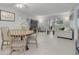 Bright living room with a dining area and sliding glass doors to the lanai at 6508 Tina Dr # 14, New Port Richey, FL 34653