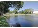 Beautiful pond view with fountain, showcasing the community's lush landscaping and serene environment at 6508 Tina Dr # 14, New Port Richey, FL 34653