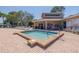Inviting hot tub area with comfortable lounge chairs and pool rules visible, perfect for relaxation at 6508 Tina Dr # 14, New Port Richey, FL 34653