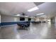 Spacious recreation room with tile floors, ceiling fans, large screen televisions, and tables with seating at 6508 Tina Dr # 14, New Port Richey, FL 34653
