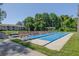Scenic shuffleboard courts provide a charming recreational space, surrounded by greenery and benches at 6508 Tina Dr # 14, New Port Richey, FL 34653
