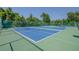 Well-maintained tennis courts surrounded by lush greenery offer a perfect recreational space at 6508 Tina Dr # 14, New Port Richey, FL 34653