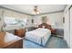 Traditional bedroom features coordinating décor, including patterned wallpaper and window treatments at 6823 Oak Hill Dr, New Port Richey, FL 34653