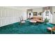Cozy living room with plush green carpet and large closet storage at 6823 Oak Hill Dr, New Port Richey, FL 34653